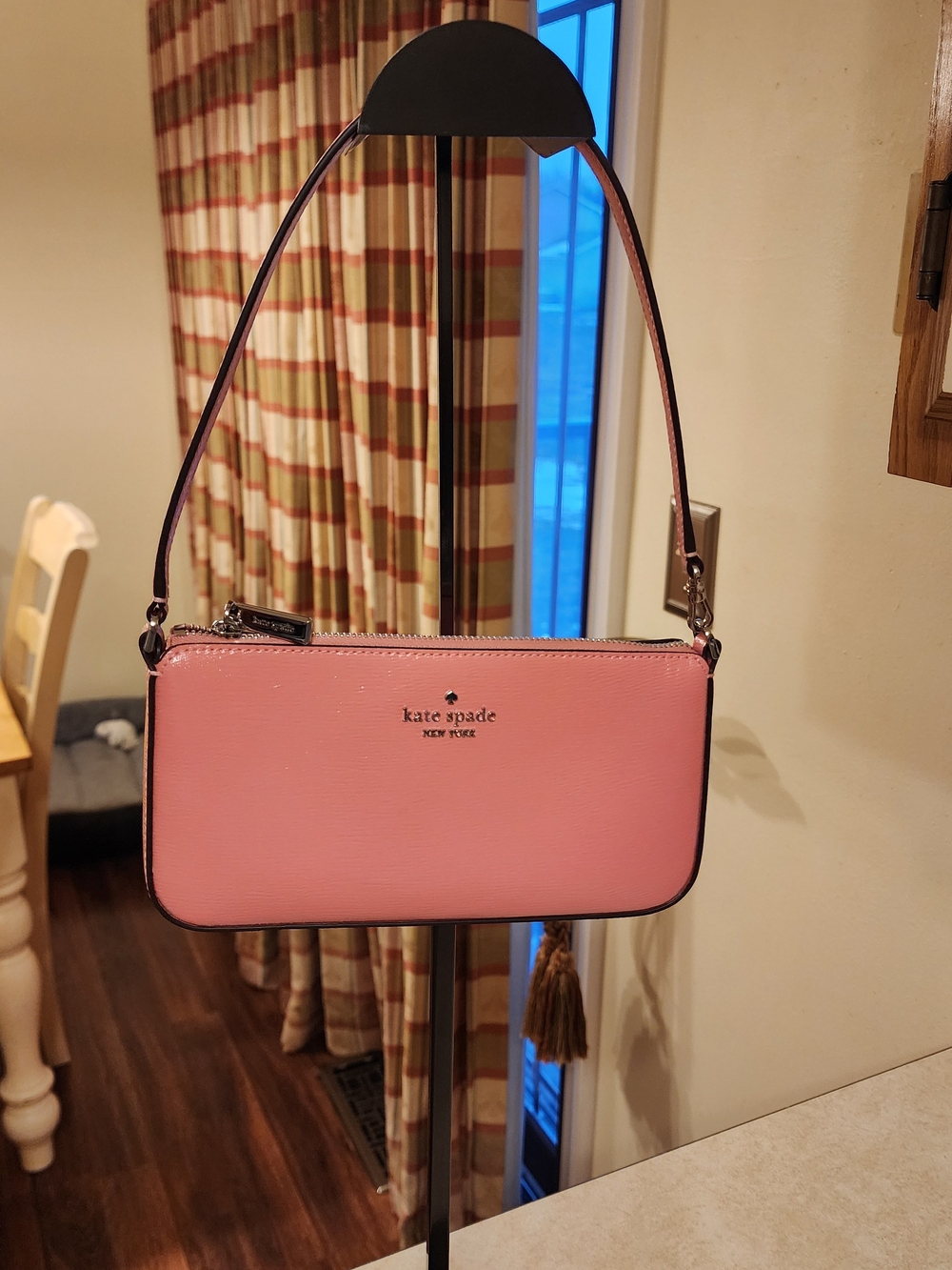 Kate Spade New York Gemini Convertible Wristlet in a pink color